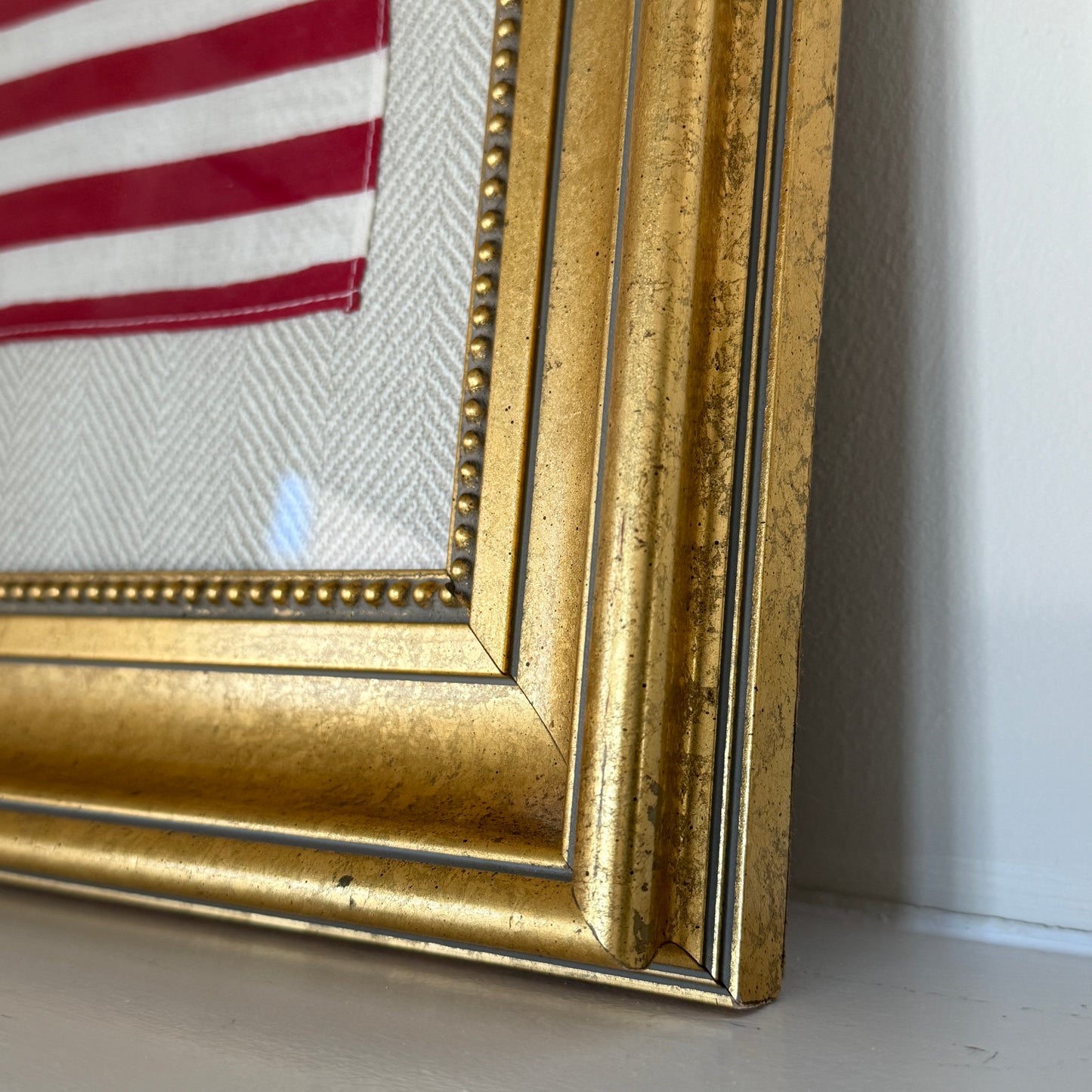 Vintage 50 Staggered Star American Flag on Neutral Heringbone Fabric in Gold Frame