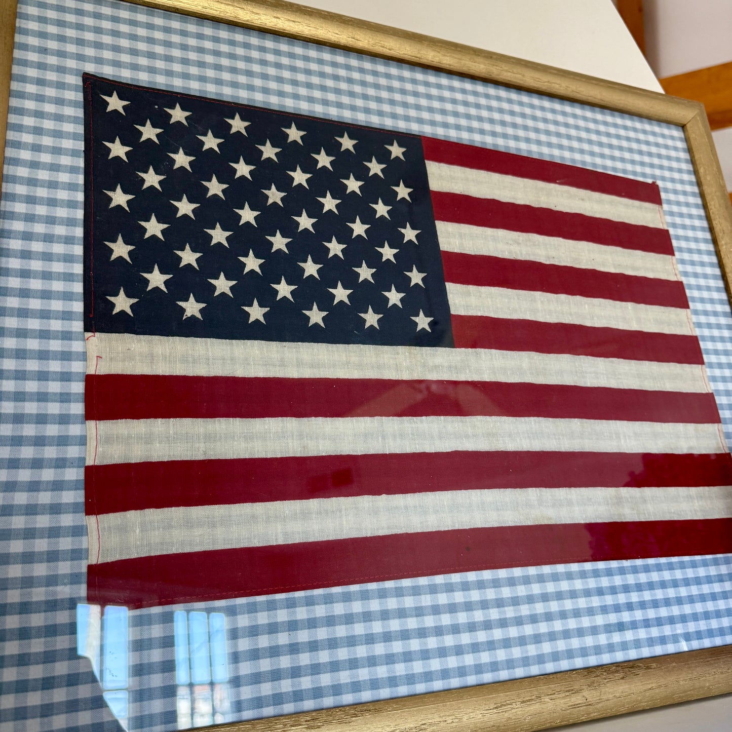 Vintage 50 Staggered Star American Flag on Light Blue Gingham Fabric in Gold Frame