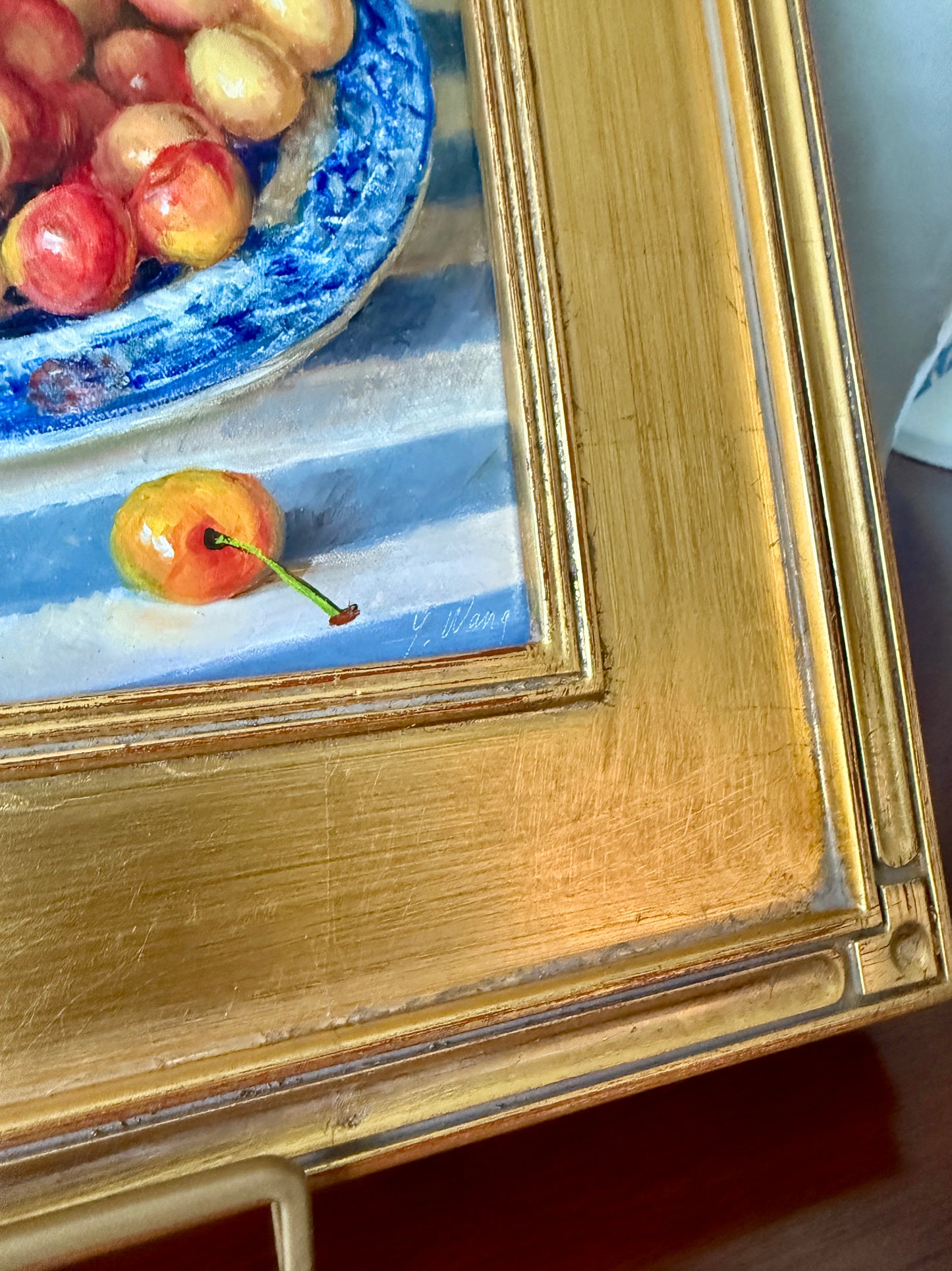 Rainier Cherries in Blue and White Bowl on Striped Tablecloth in Gold Frame