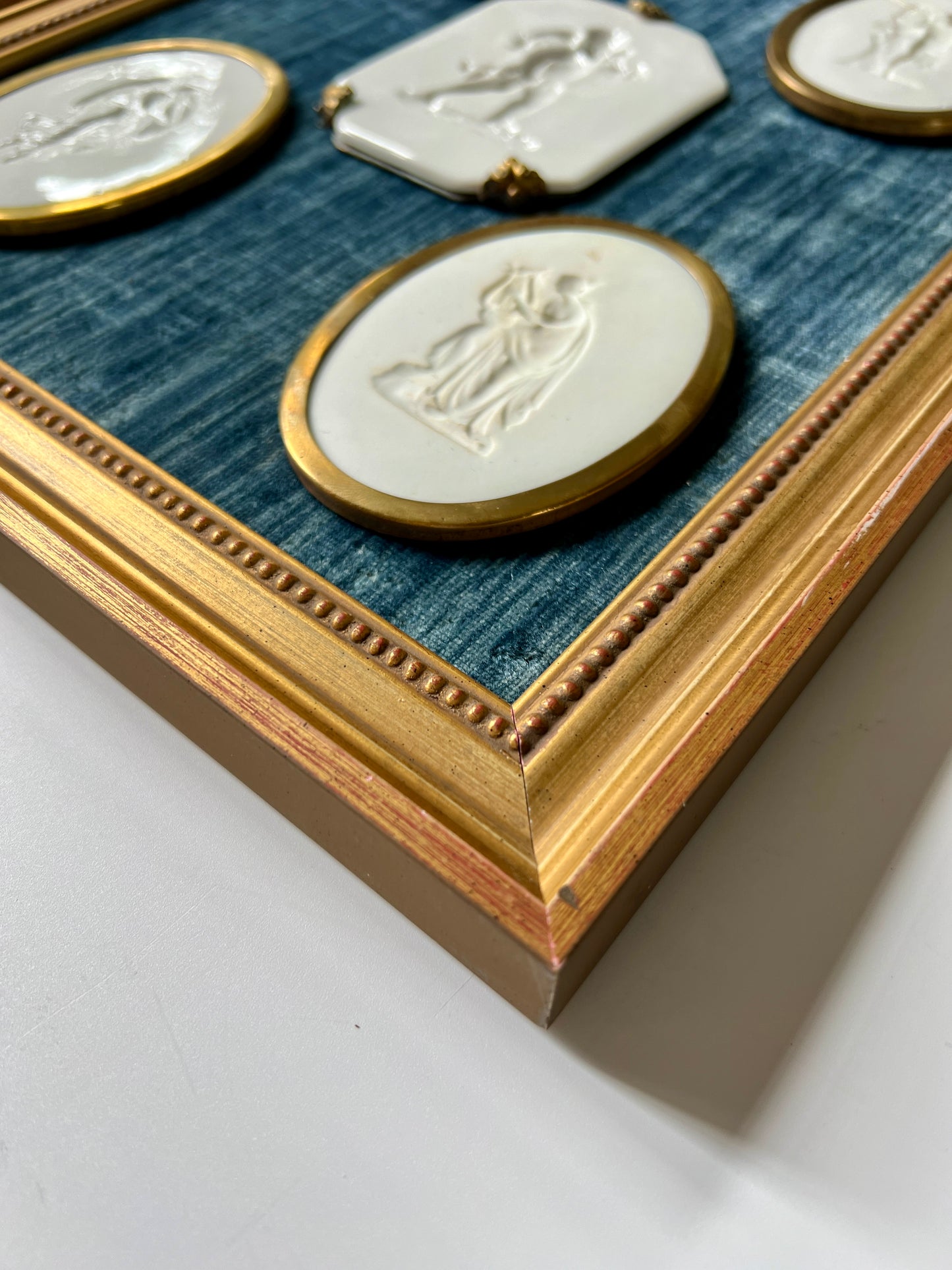 Pair of 10 Gold Wrapped Intaglios on Blue Velvet in Gold Frames
