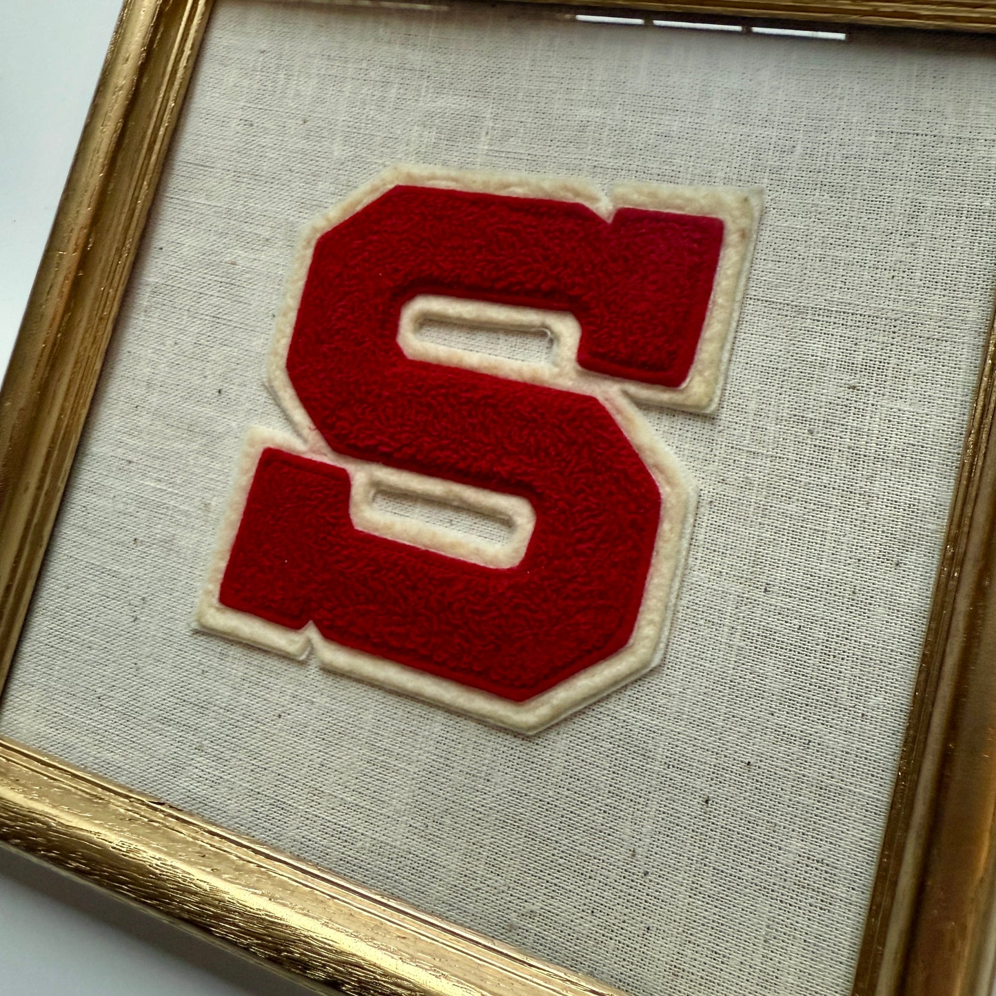 Vintage Varsity Initial Letter "S" on Natural Linen Fabric in Gold Frame