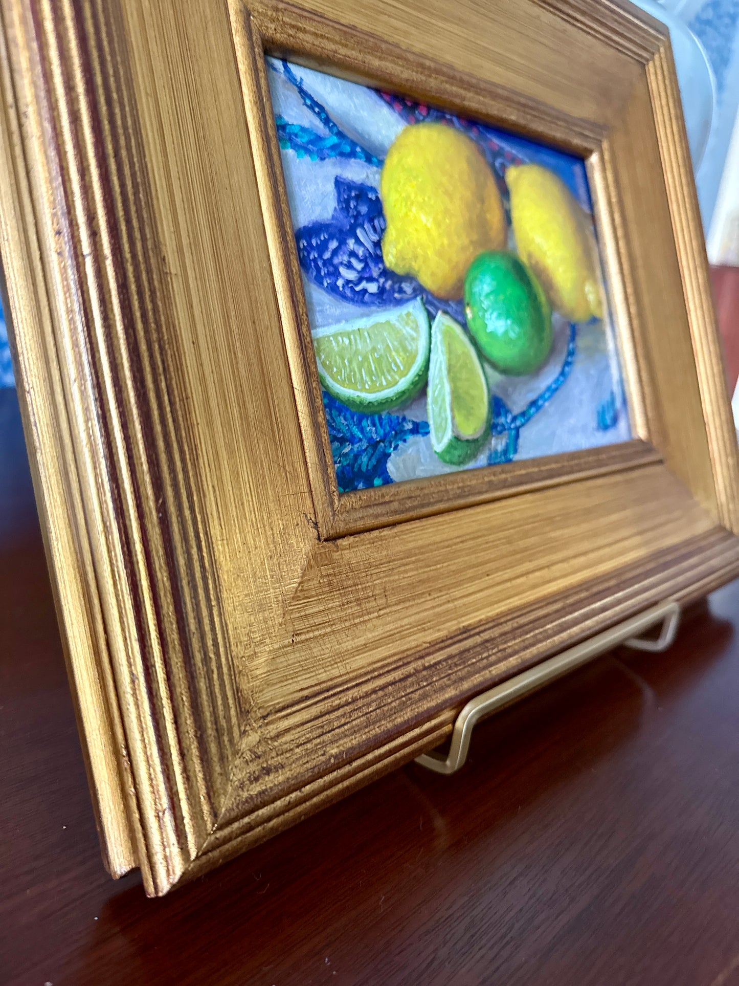 Lemons and Limes on Blue and White Tablecloth Realist Still Life Oil Painting in Gold Frame