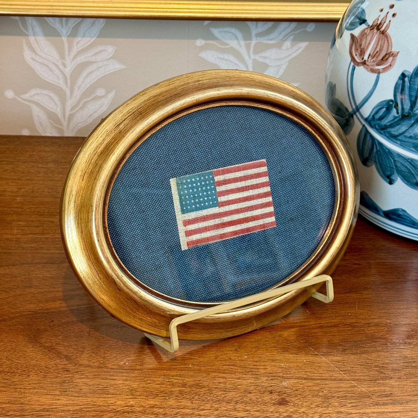 Antique 48 Star Glazed Cotton American Parade Flag on Blue Twill in Gold Oval Frame