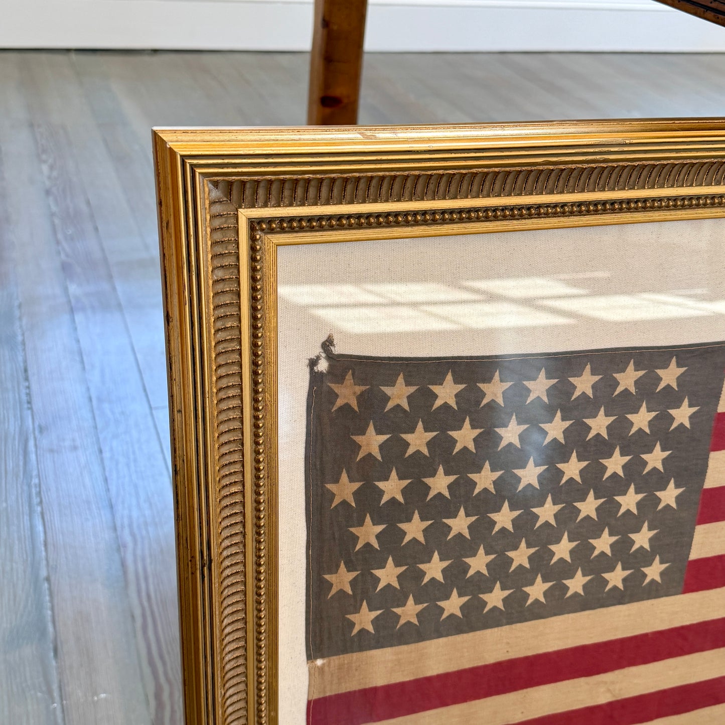 Antique 48 Staggered Star American Flag on Ivory Duck Cloth in Gold Scoop Frame
