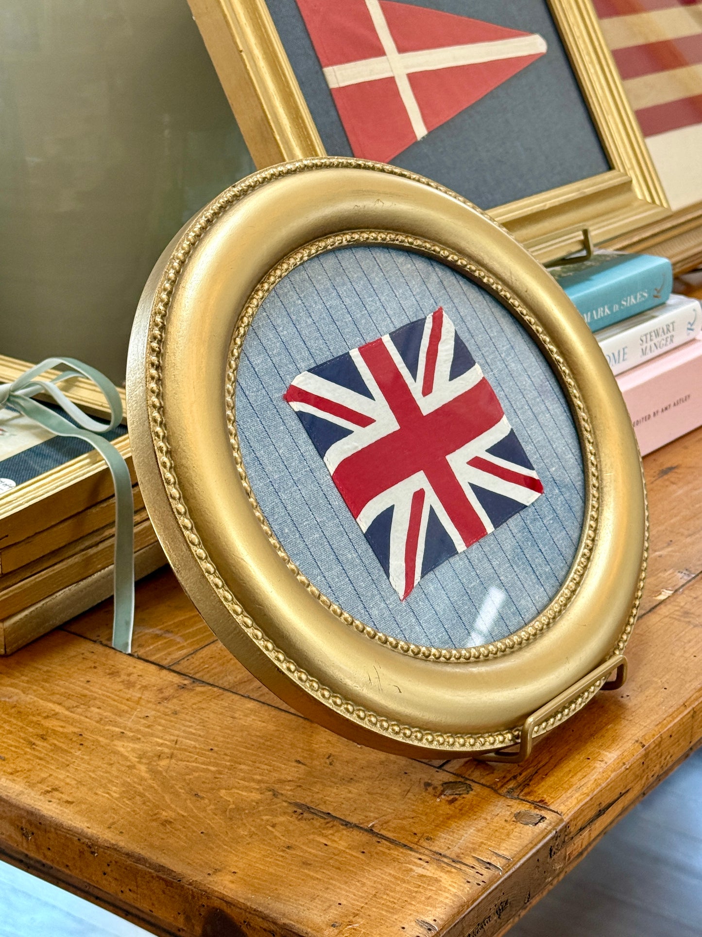 Vintage Cotton Union Jack Flag on Blue and Navy Stripes in Gold Oval Frame