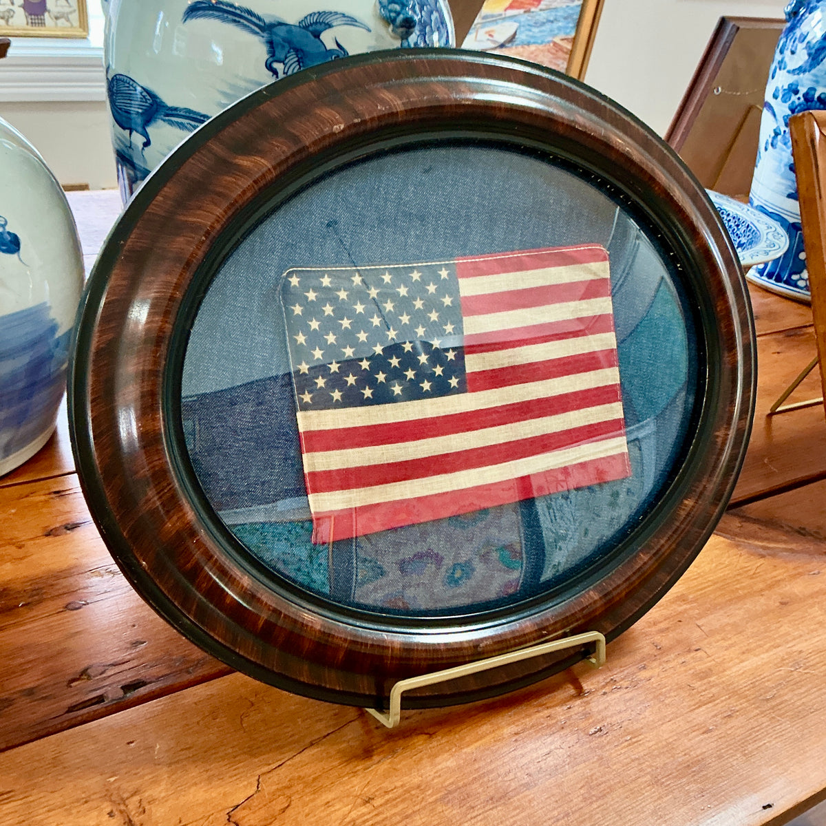 Vintage 50 Star American Flag on Dark Chambray in Convex Glass Oval Wood Frame