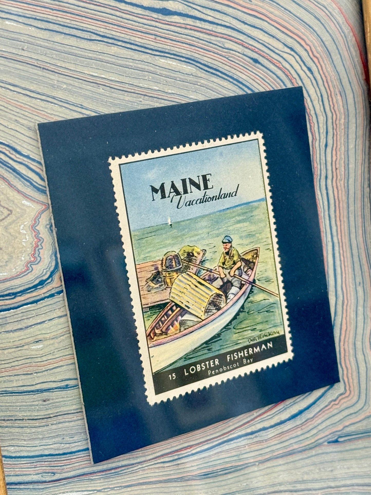 Set of Three 1940 Maine "Vacationland" Stamps on Blue Hand Marbled Paper in Gold Frames
