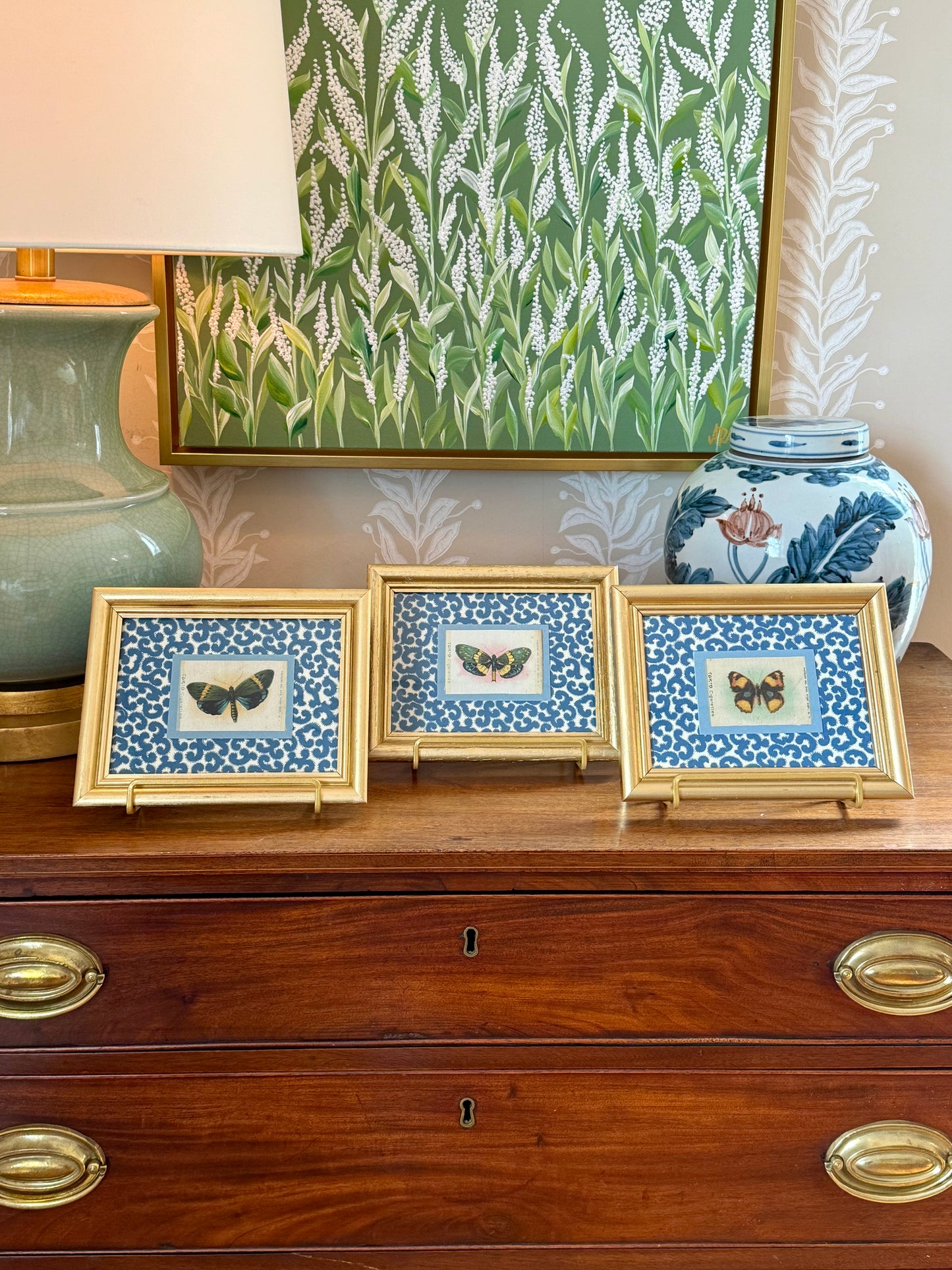Set of Three Antique Butterfly Tobacco Silks on Blue and White Fabric in Gold Frames