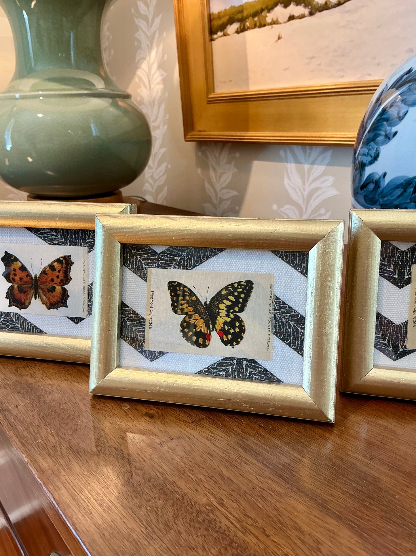 Set of Three Antique Butterfly Tobacco Silks on Black and White Zigzag in Gold Frames