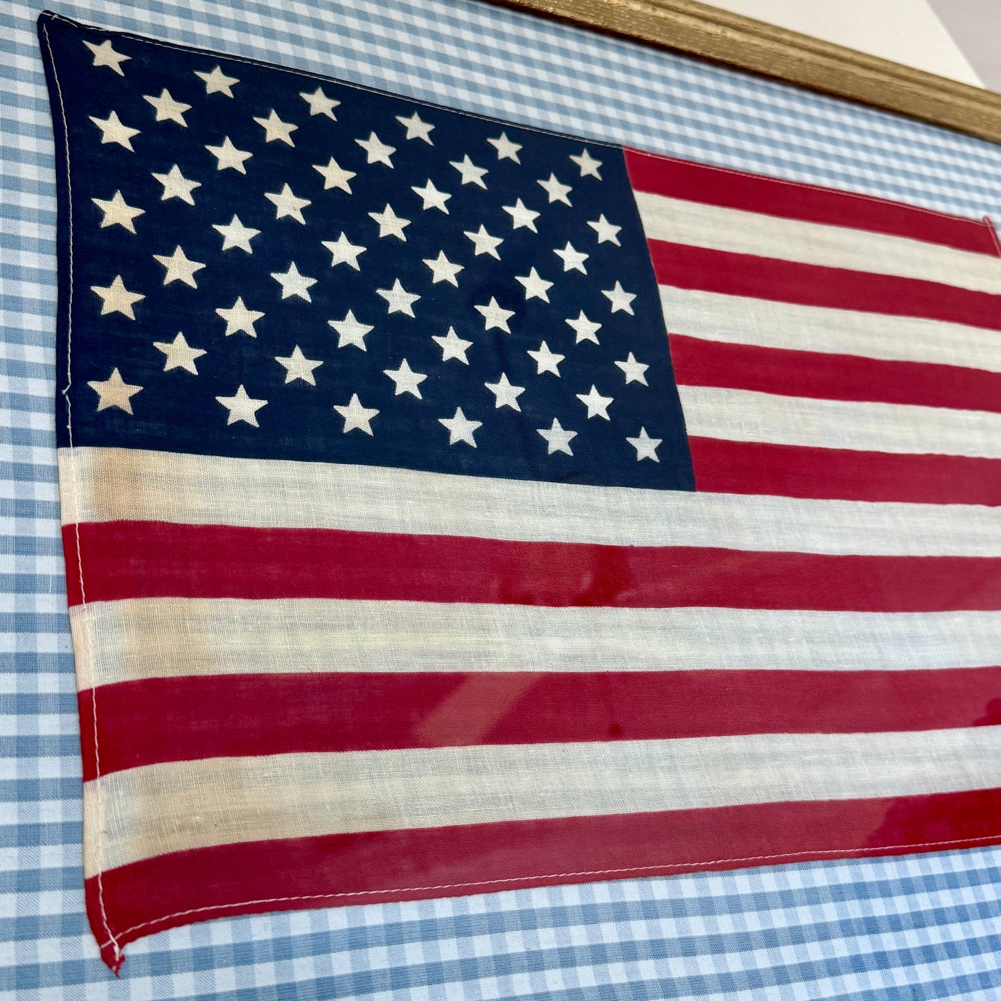 Vintage 50 Staggered Star American Flag on Light Blue Gingham Fabric in Gold Frame