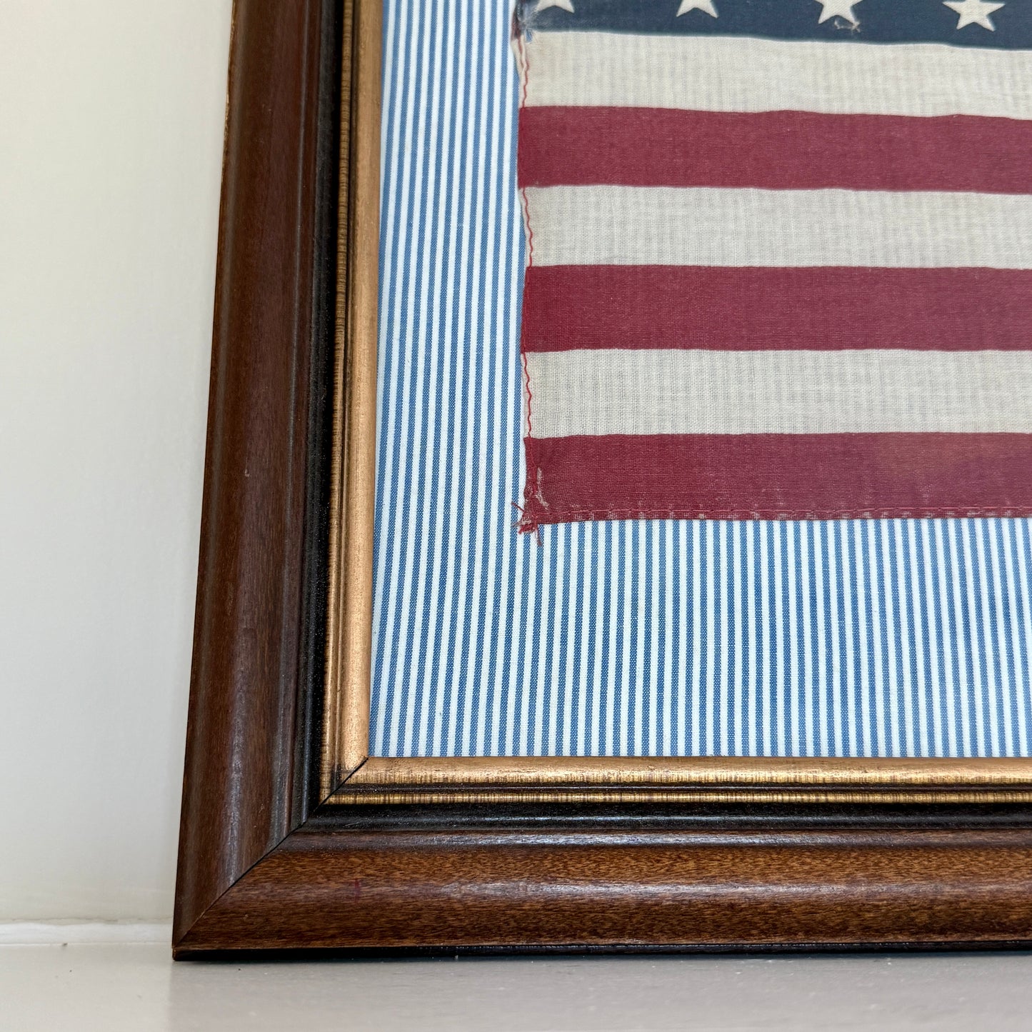 Vintage 50 Staggered Star American Flag on Blue Ticking Striped Fabric in Wood and Gold Frame