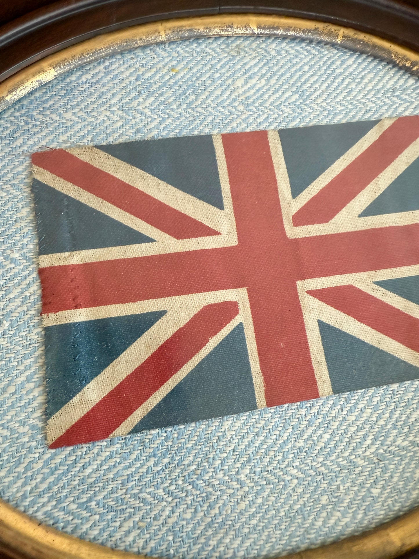 Vintage Union Jack British Parade Flag on Light Blue Herringbone in Antique Oval Wood Frame