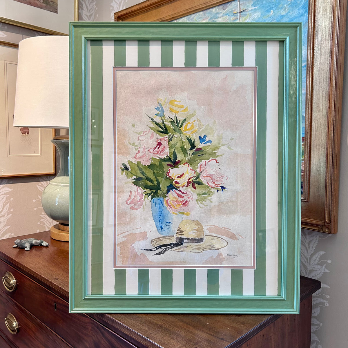Floral and Wide Brimmed Hat Still Life manner of Ludwig Bemelmans Watercolor Painting in Painted Green Frame