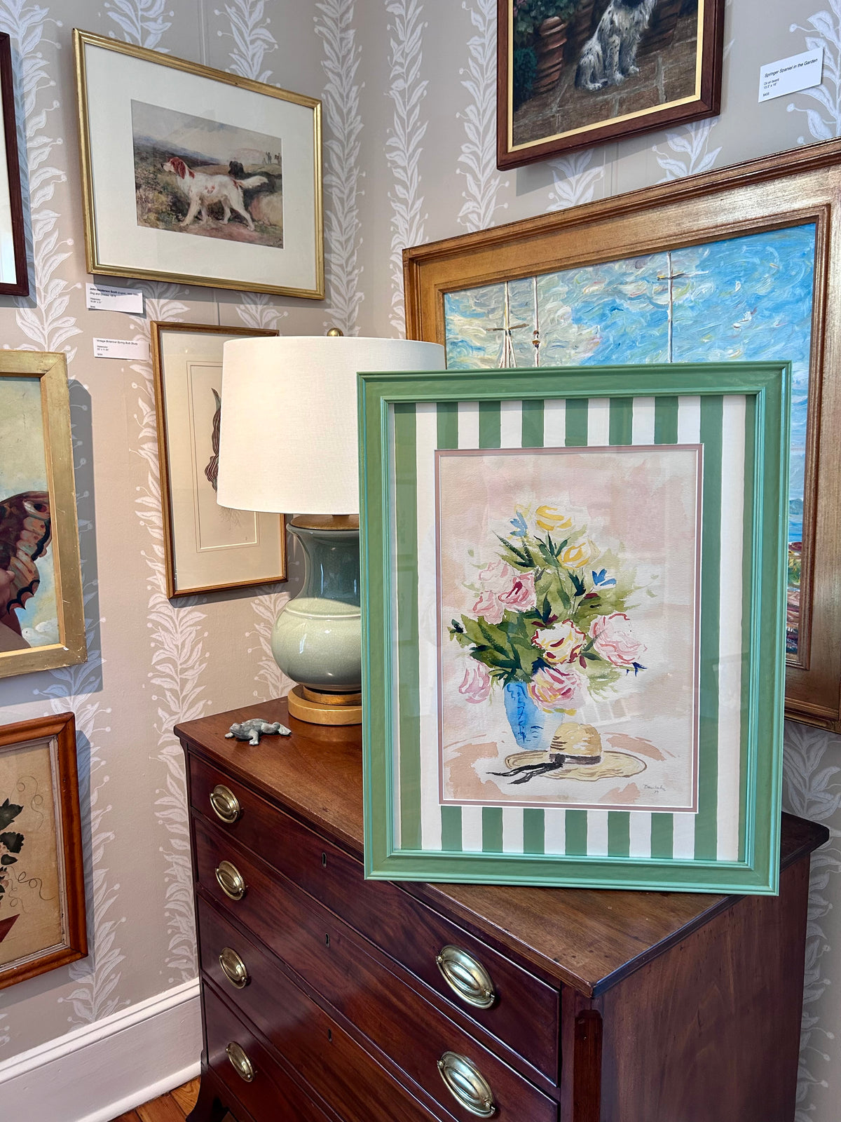 Floral and Wide Brimmed Hat Still Life manner of Ludwig Bemelmans Watercolor Painting in Painted Green Frame