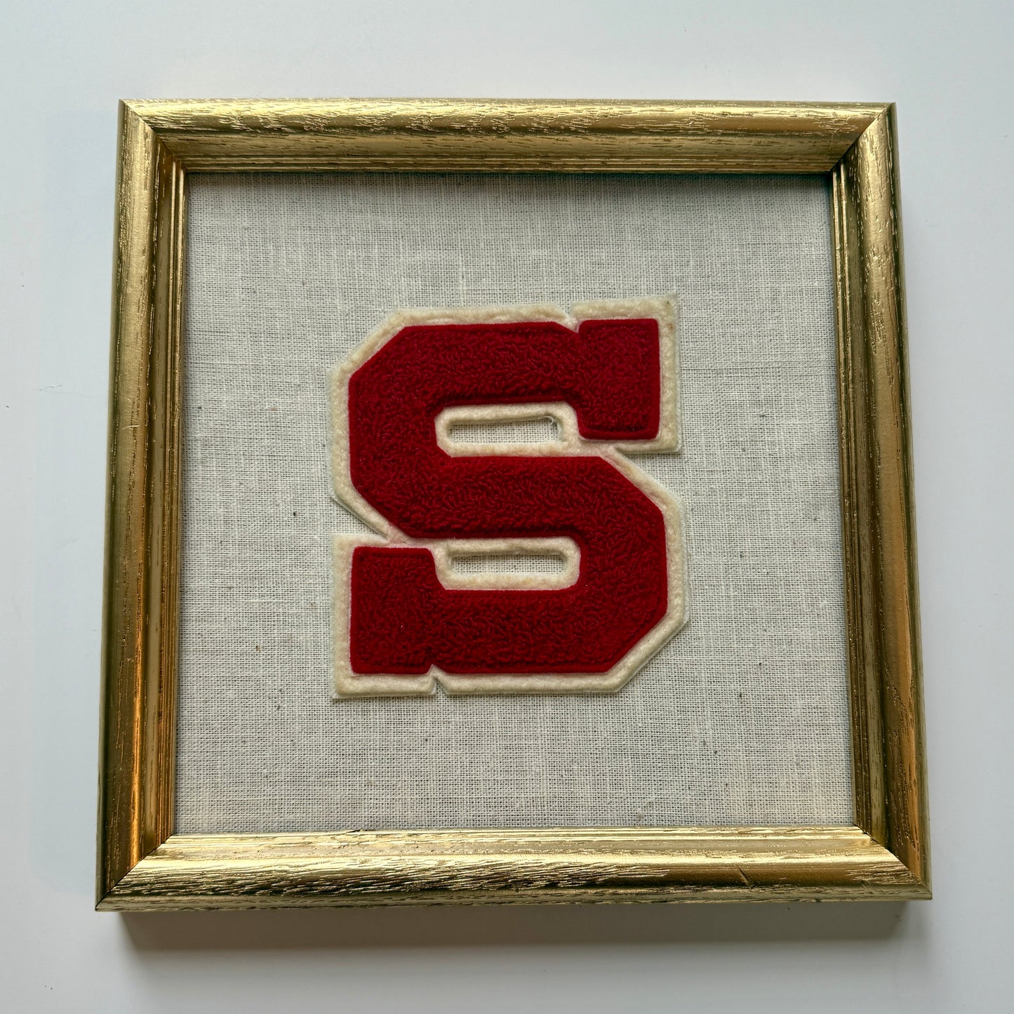 Vintage Varsity Initial Letter "S" on Natural Linen Fabric in Gold Frame