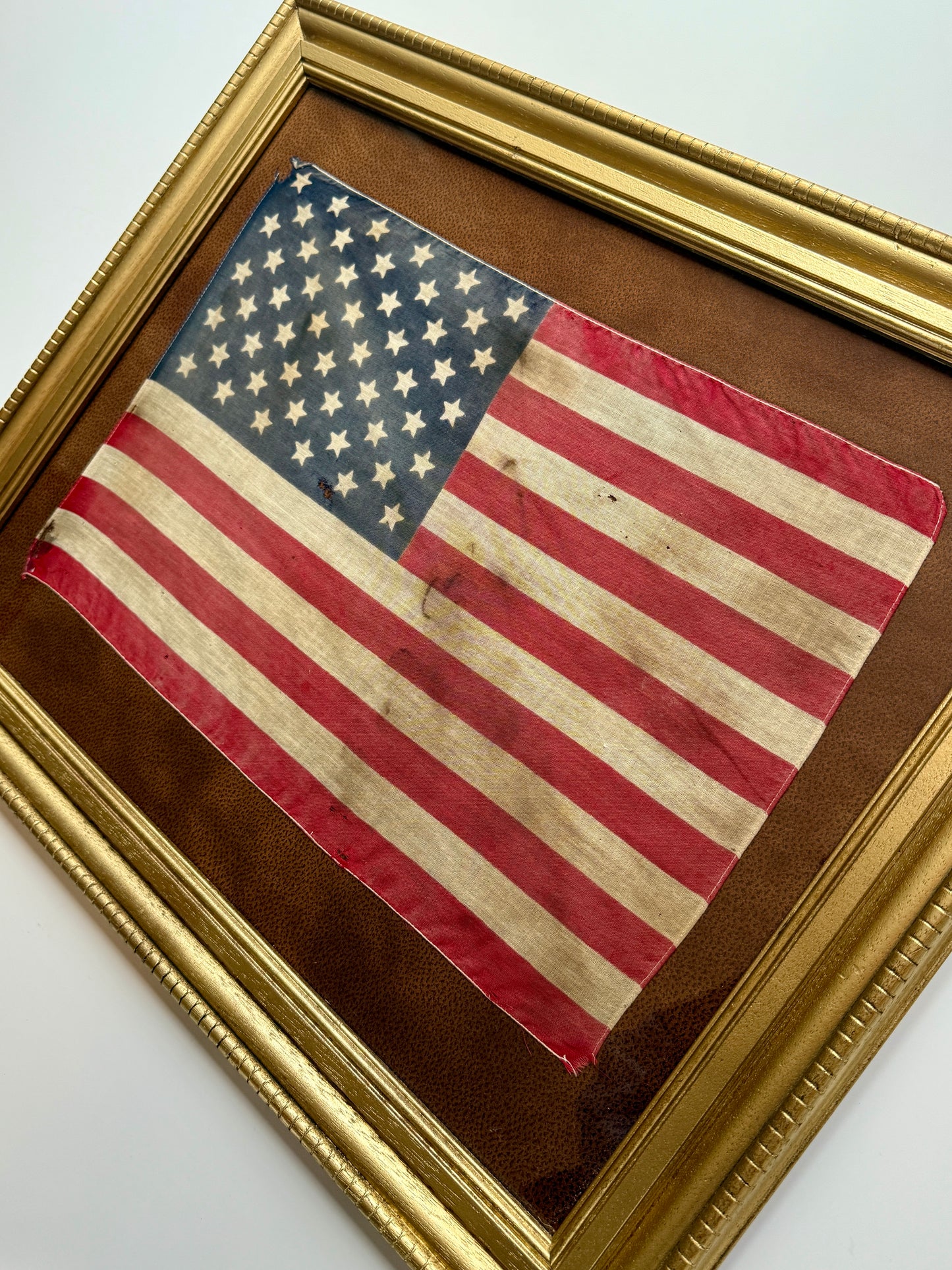 Vintage 50 Star American Flag on Faux Leather in Gold Frame