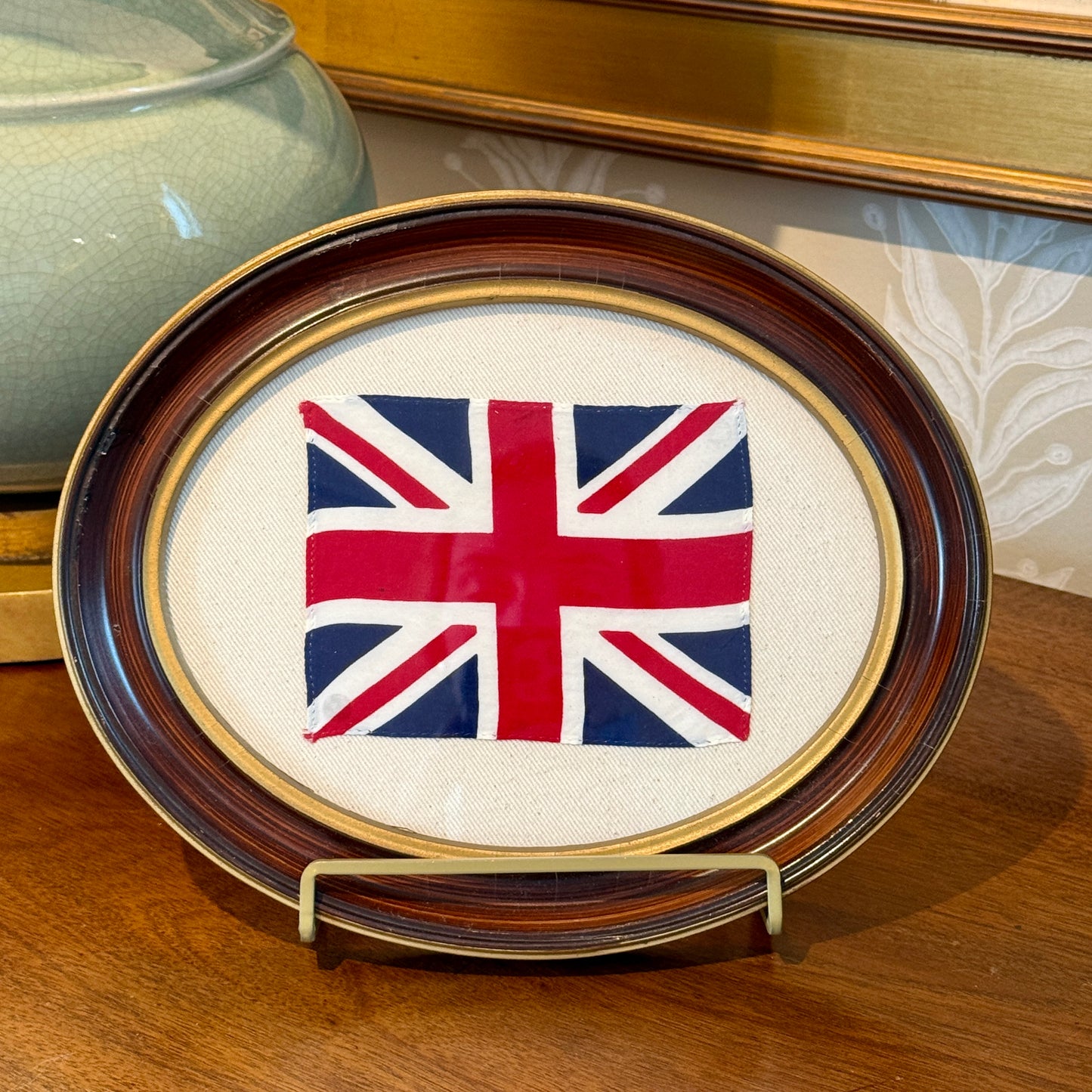 Union Jack Parade Flag on Ivory Twill in Antique Oval Wood Frame