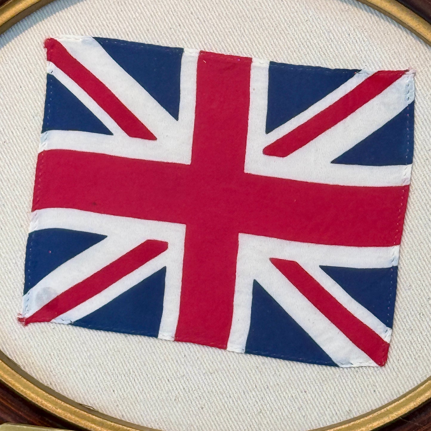Union Jack Parade Flag on Ivory Twill in Antique Oval Wood Frame