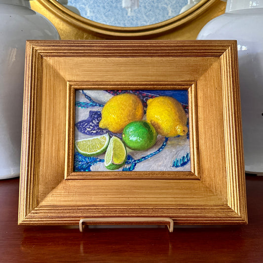 Lemons and Limes on Blue and White Tablecloth Realist Still Life Oil Painting in Gold Frame