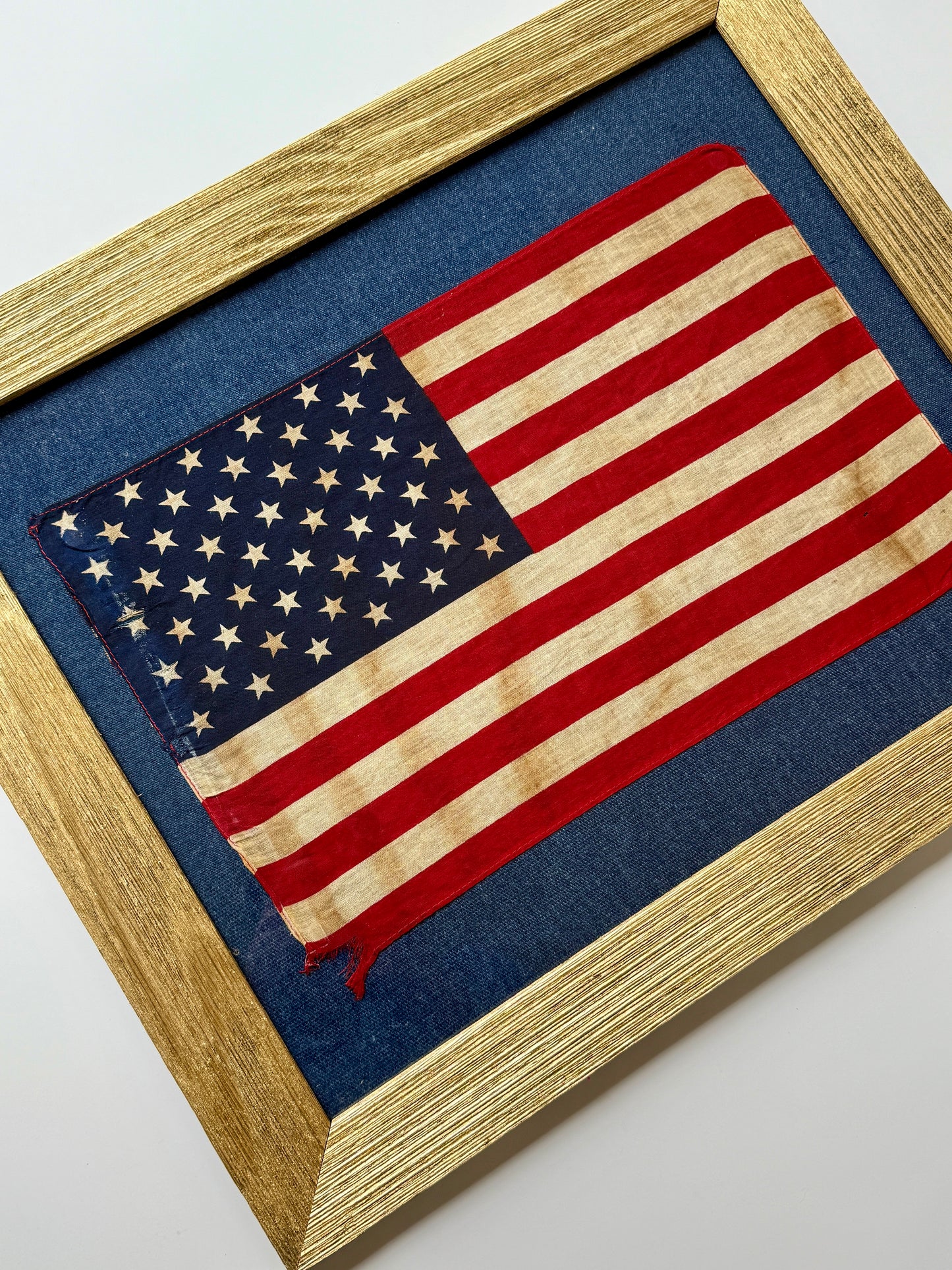 Vintage 50 Staggered Star American Flag on Blue Canvas in Gold Barnwood Frame