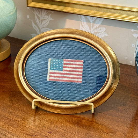 Antique 48 Star Glazed Cotton American Parade Flag on Blue Twill in Gold Oval Frame