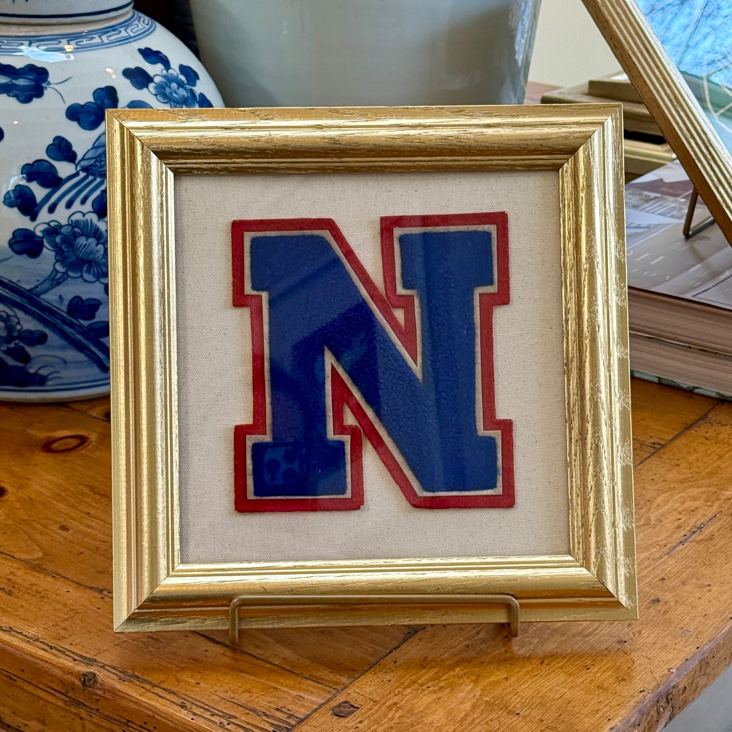 Vintage Red and Blue Varsity Letter Initial N on Ivory Duck Cloth in Gold Frame
