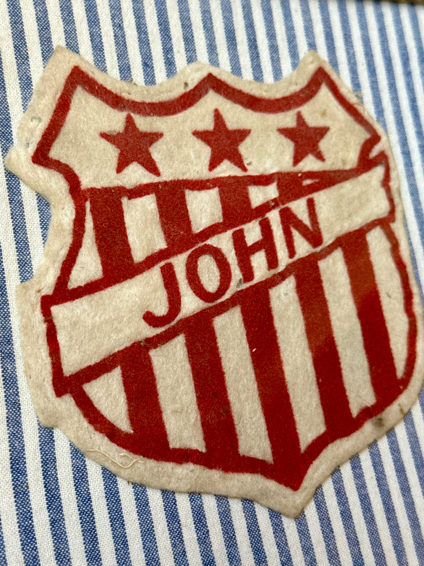 Varsity Varsity Jacket John Patch on Blue White Ticking Stripe in Gold Frame