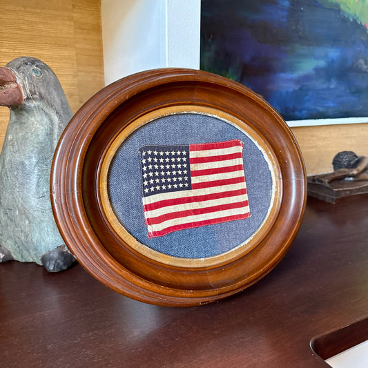 Old 48 Star American Parade Flag on Blue Oxford Fabric in 19th Century Oval Frame