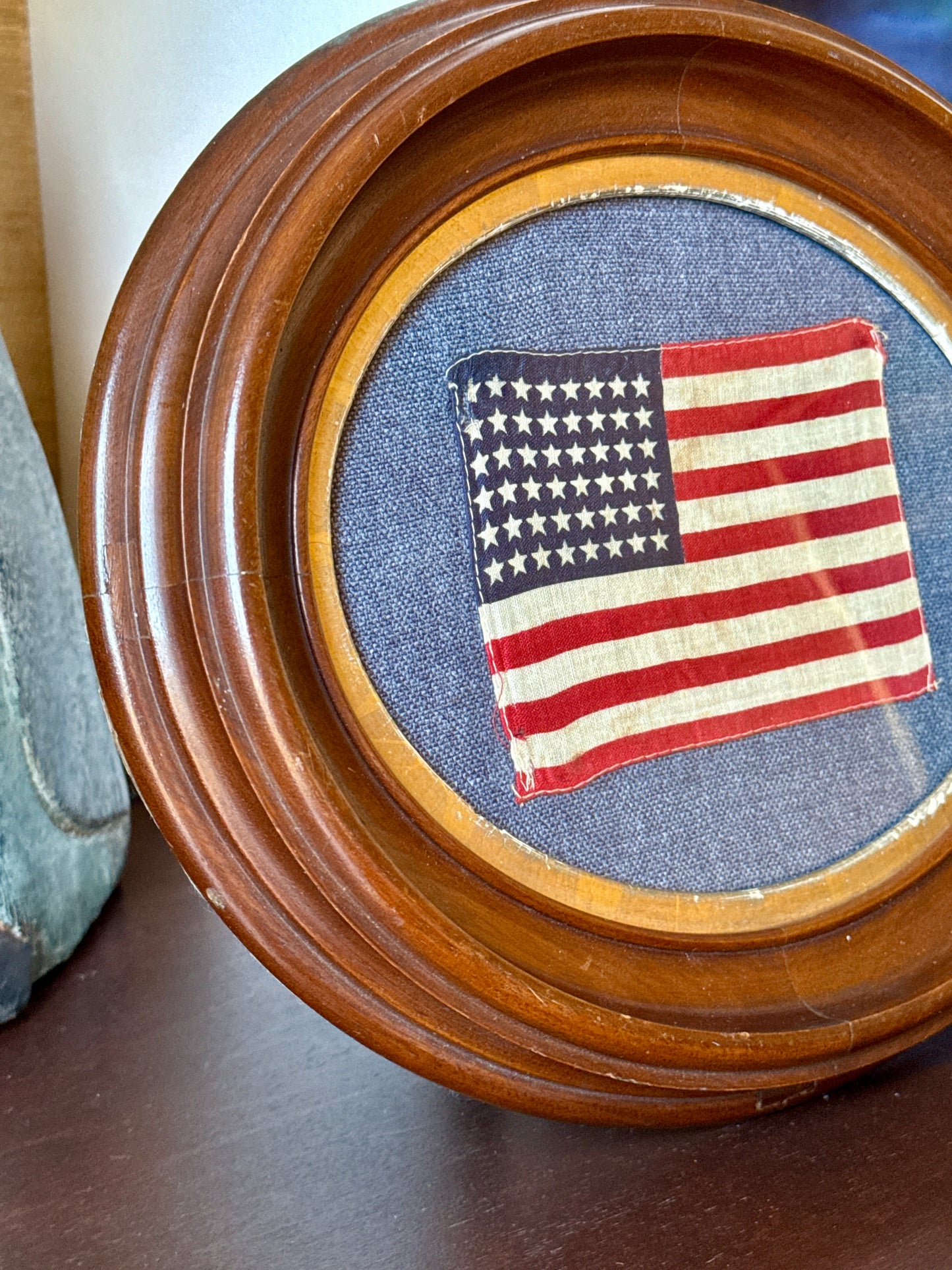 Old 48 Star American Parade Flag on Blue Oxford Fabric in 19th Century Oval Frame