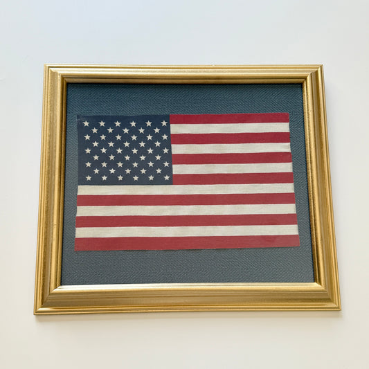 Vintage 50 Staggered Star American Parade Flag on Blue Herringbone Fabric in Gold Frame