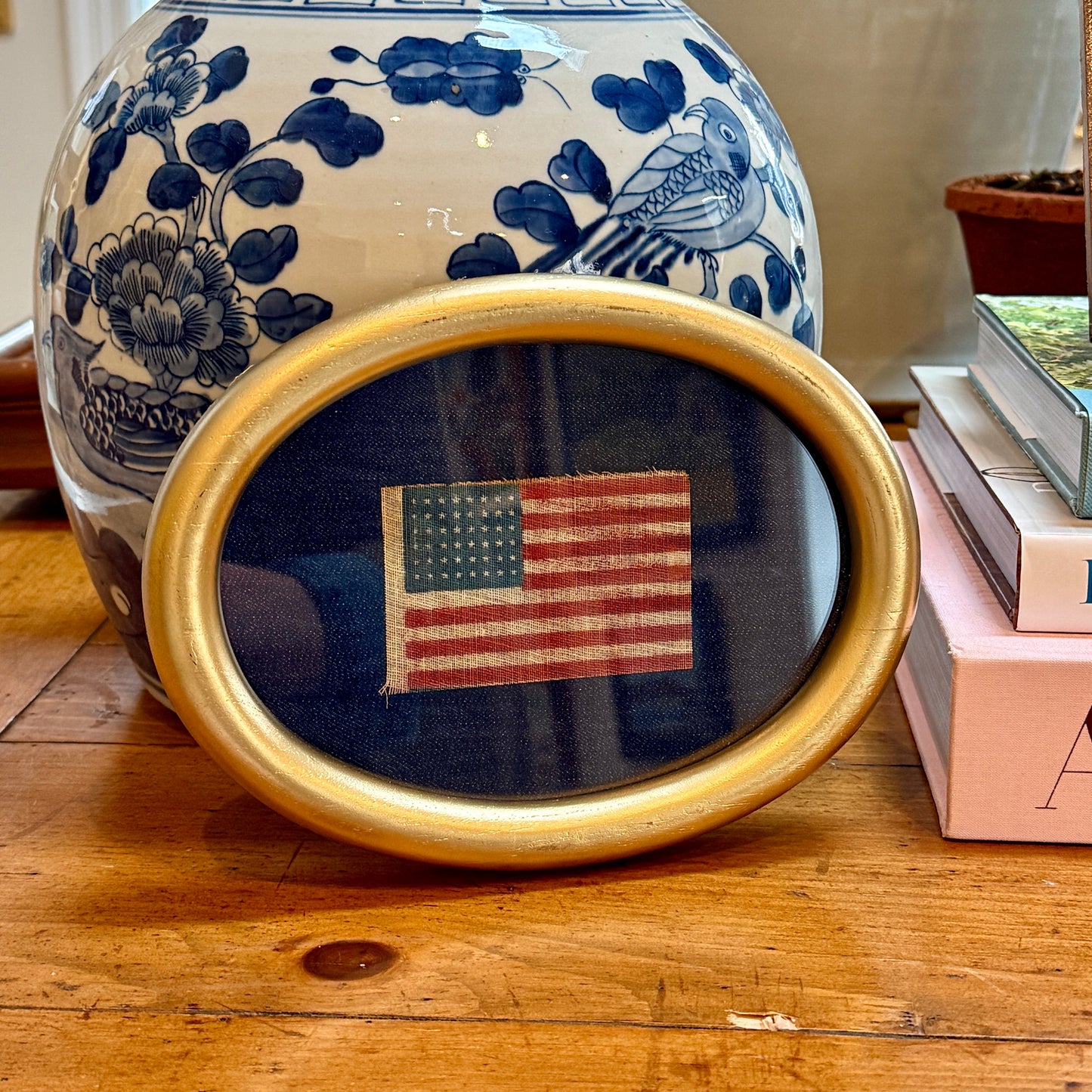 Antique 48 Star Parade Flag on Navy Canvas in Gilded Oval Frame