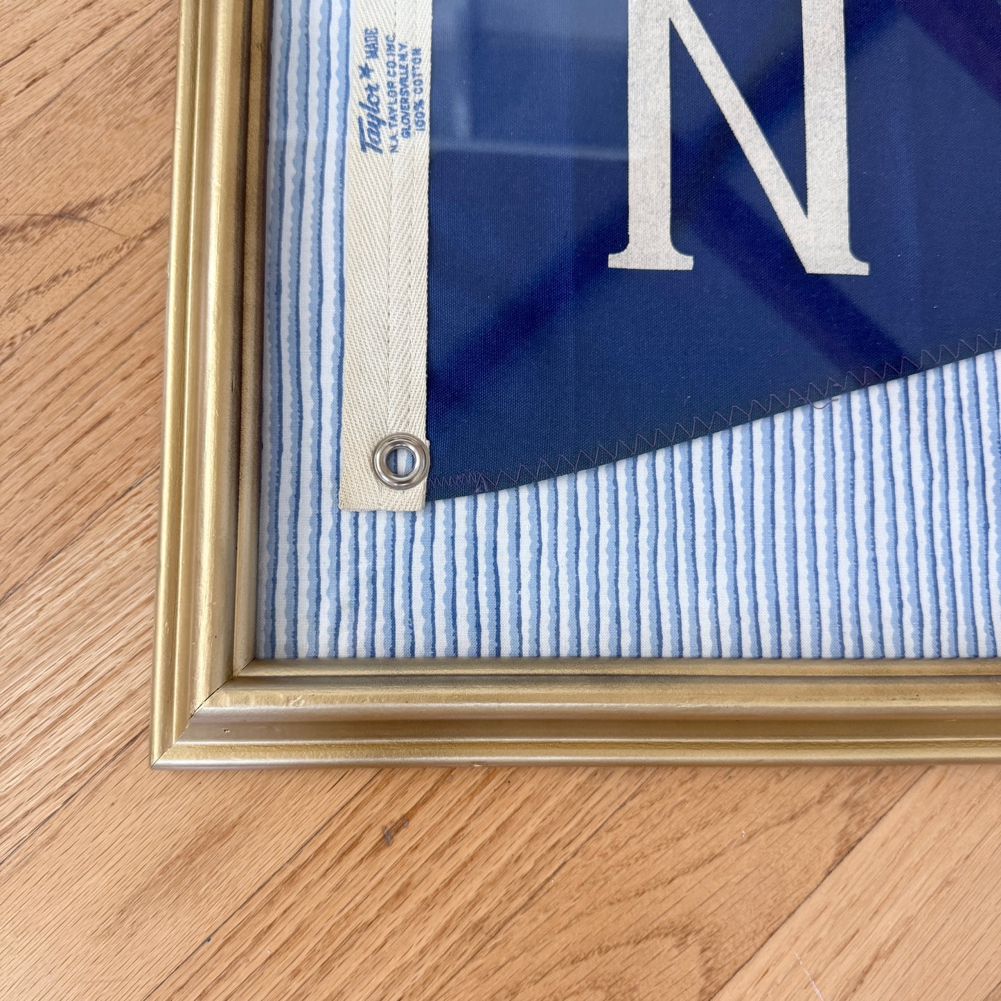 Vintage "N" Burgee Nautical Flag on Blue Wavy Striped Fabric in Gold Frame